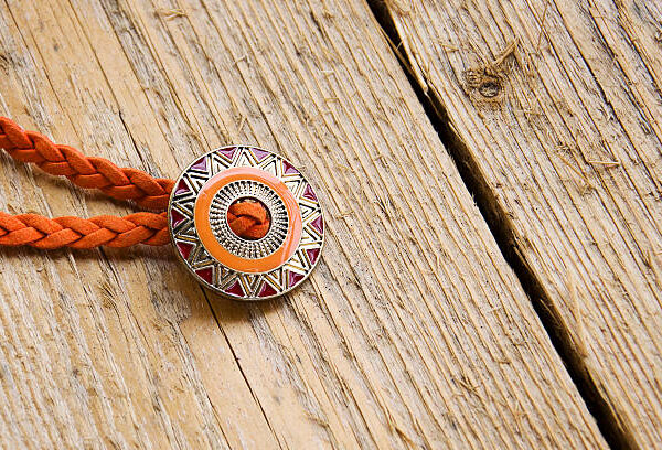 A contemporary take on the classic Western adornment is a sweat resistant bolo ties.