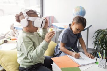 kid playing with vr glasses