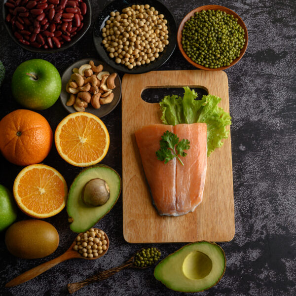 legumes fruit salmon fish pieces wooden chopping board